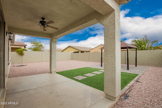 view of patio / terrace featuring a fenced backyard and ceiling fan