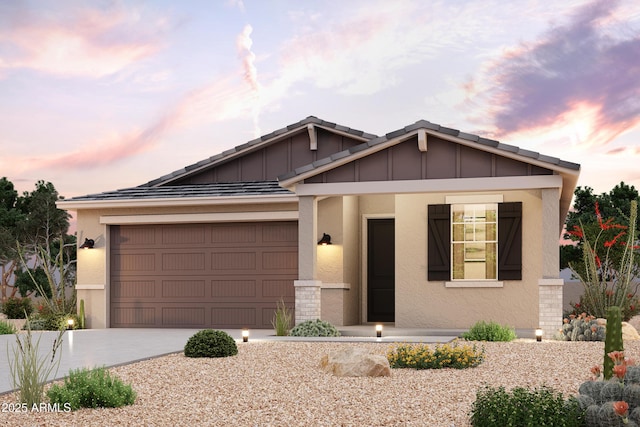 view of front facade with concrete driveway, an attached garage, board and batten siding, and stucco siding