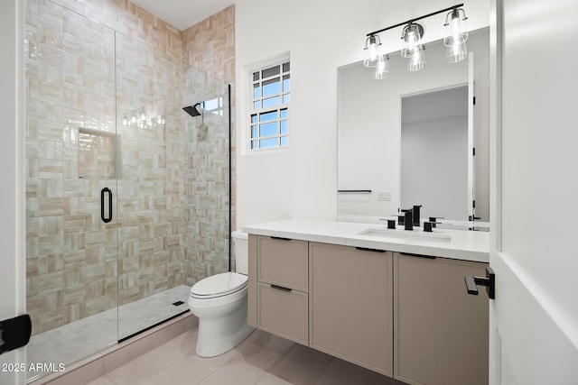 bathroom featuring vanity, toilet, tile patterned flooring, and a stall shower