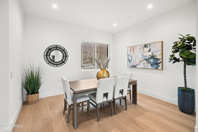 dining area featuring recessed lighting, light wood finished floors, and baseboards