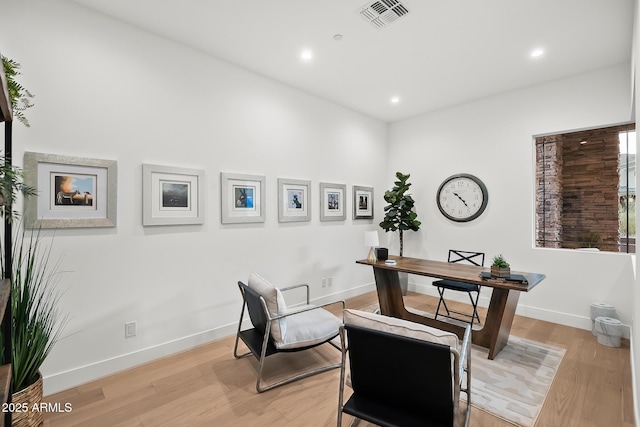 home office featuring recessed lighting, visible vents, baseboards, and light wood-type flooring