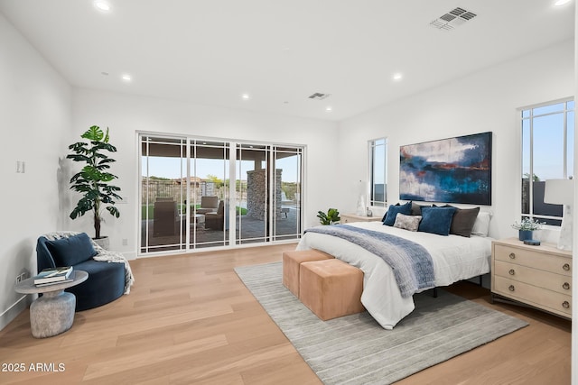 bedroom featuring wood finished floors, recessed lighting, and visible vents