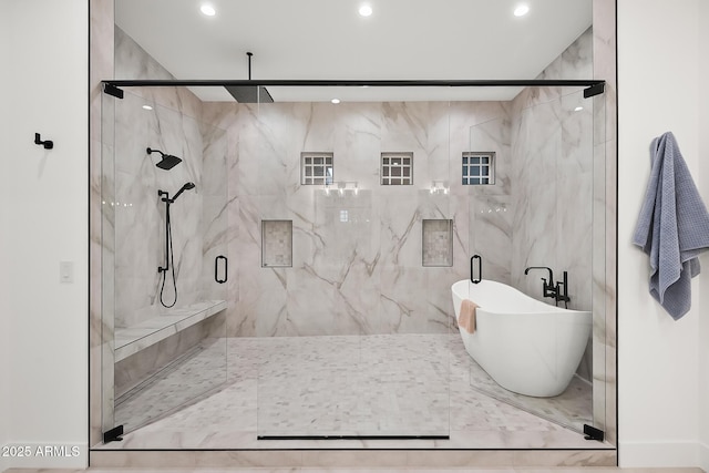 full bath with recessed lighting, a freestanding bath, and a marble finish shower