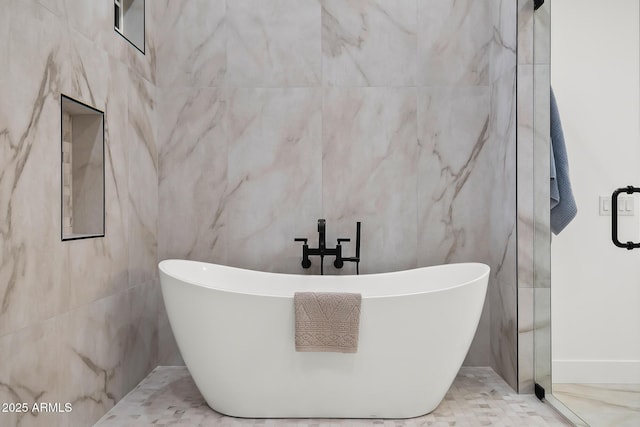 full bathroom with a freestanding bath