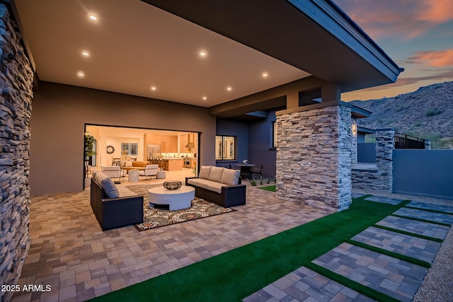 view of patio / terrace with an outdoor hangout area and a mountain view
