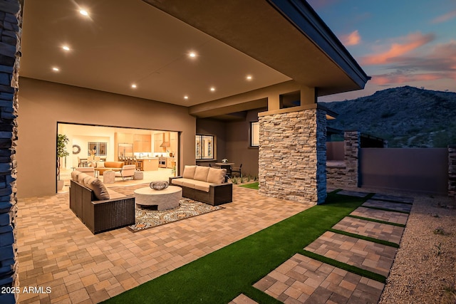 view of patio / terrace featuring outdoor lounge area and a mountain view