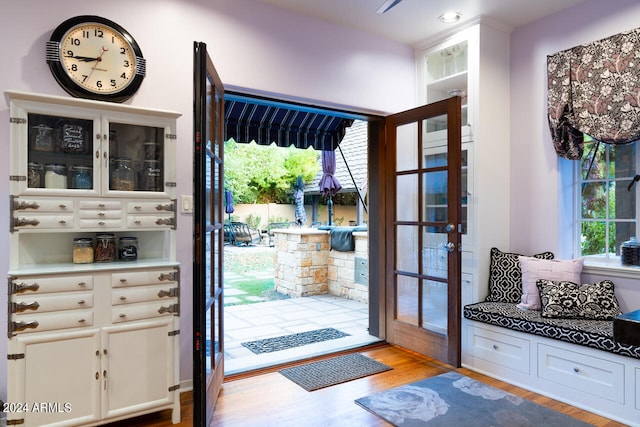 doorway to outside with light hardwood / wood-style flooring