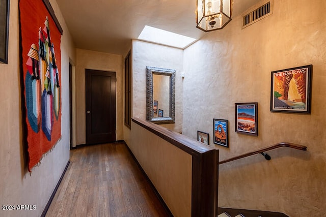 corridor featuring wood-type flooring