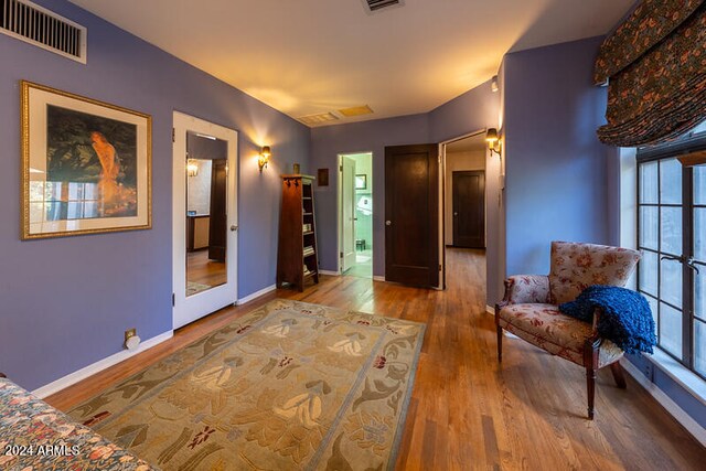 unfurnished room featuring hardwood / wood-style flooring and a wealth of natural light