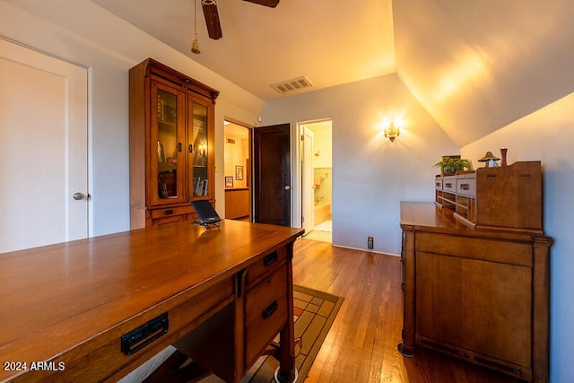 interior space featuring vaulted ceiling, light wood-type flooring, and ceiling fan