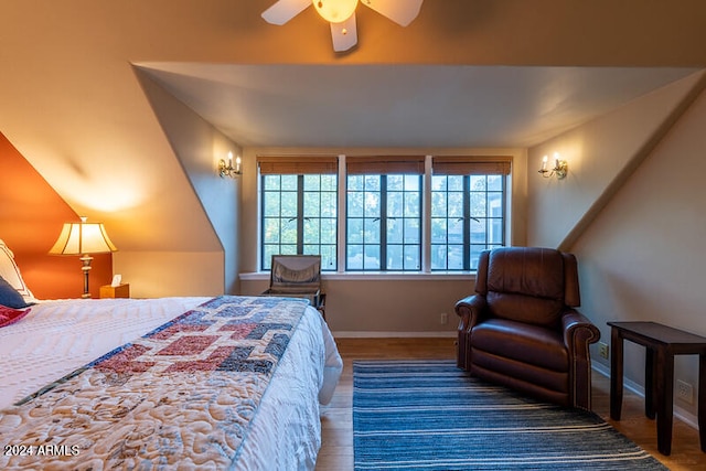 bedroom featuring vaulted ceiling, wood-type flooring, and ceiling fan