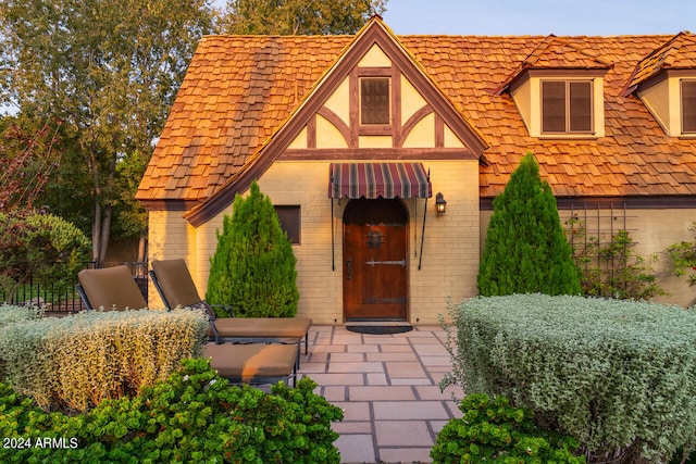 property entrance with a patio