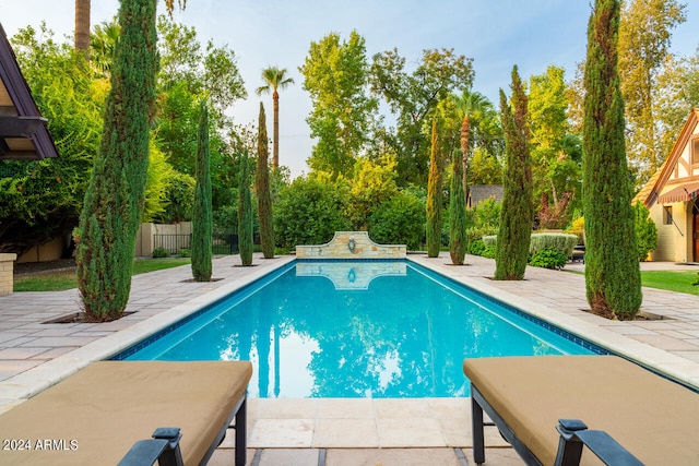 view of swimming pool featuring a patio