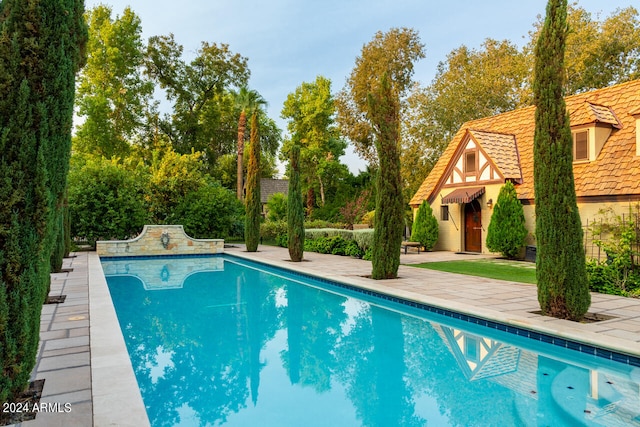 view of pool featuring a patio