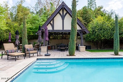 view of pool with a gazebo and a patio