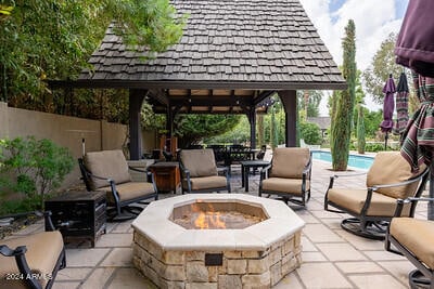 view of patio with a gazebo and a fire pit