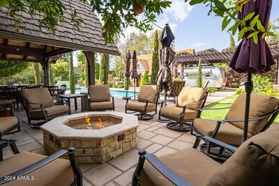 view of patio / terrace with a gazebo and an outdoor living space with a fire pit