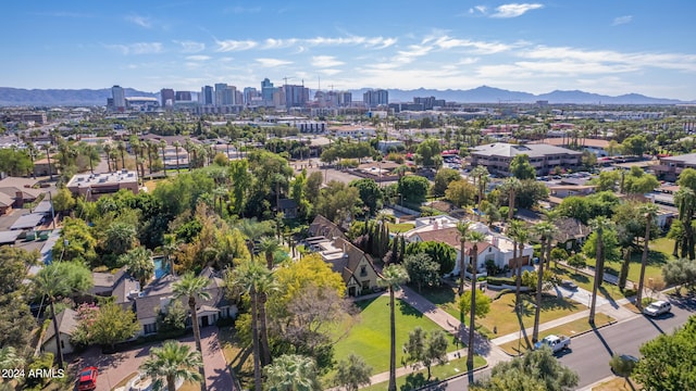 birds eye view of property with a mountain view