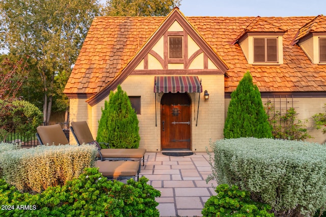 doorway to property with a patio