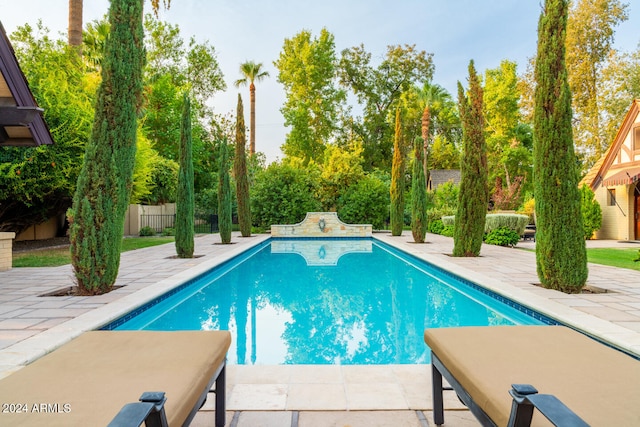 view of swimming pool featuring a patio