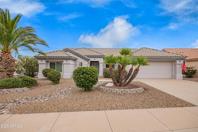14609 W Black Gold Ln, Sun City West, AZ 85375 - view of front of property with stucco siding, driveway, an attached garage, and a tiled roof