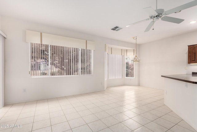 14609 W Black Gold Ln, Sun City West, AZ 85375 - spare room featuring a ceiling fan, a chandelier, and recessed lighting