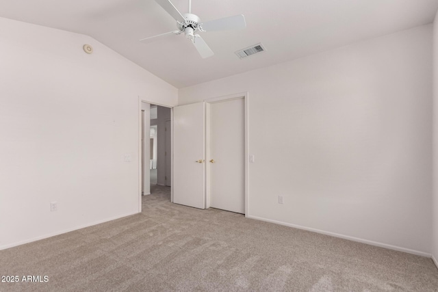 14609 W Black Gold Ln, Sun City West, AZ 85375 - unfurnished bedroom with light carpet, vaulted ceiling, baseboards, a ceiling fan, and a closet