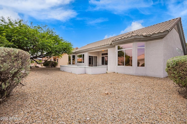 14609 W Black Gold Ln, Sun City West, AZ 85375 - rear view of property featuring stucco siding and a tile roof