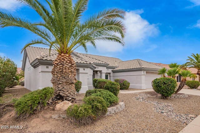 14609 W Black Gold Ln, Sun City West, AZ 85375 - mediterranean / spanish-style house featuring a garage, stucco siding, and a tile roof