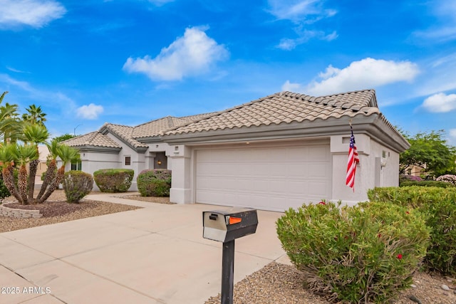 14609 W Black Gold Ln, Sun City West, AZ 85375 - mediterranean / spanish-style home with a tiled roof, driveway, an attached garage, and stucco siding