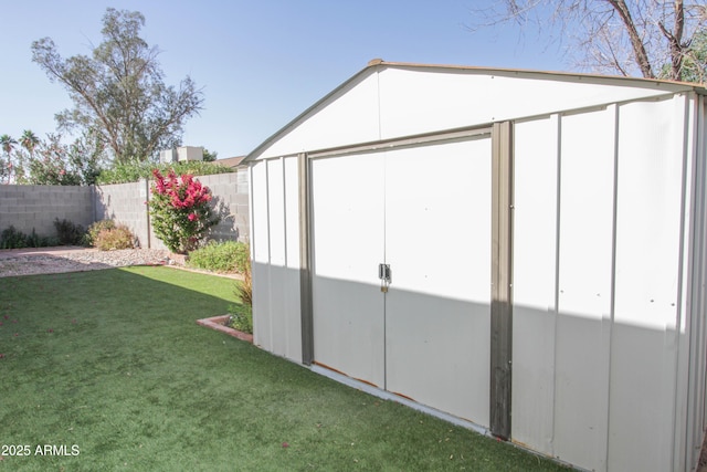 view of shed with fence