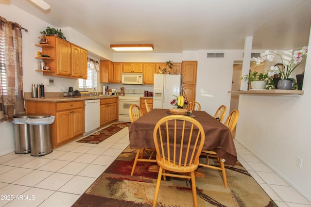 kitchen with white appliances, visible vents, open shelves, and light tile patterned flooring