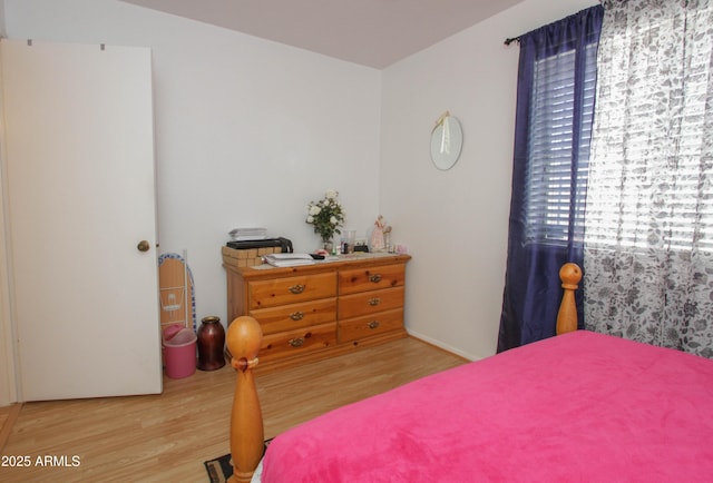 bedroom featuring wood finished floors