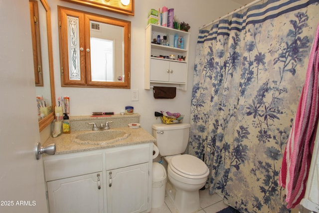 bathroom with curtained shower, toilet, vanity, visible vents, and tile patterned floors