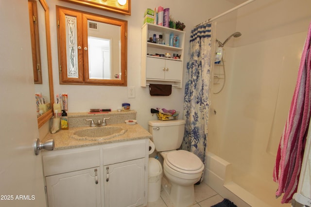 bathroom featuring visible vents, toilet, a shower with curtain, tile patterned flooring, and vanity