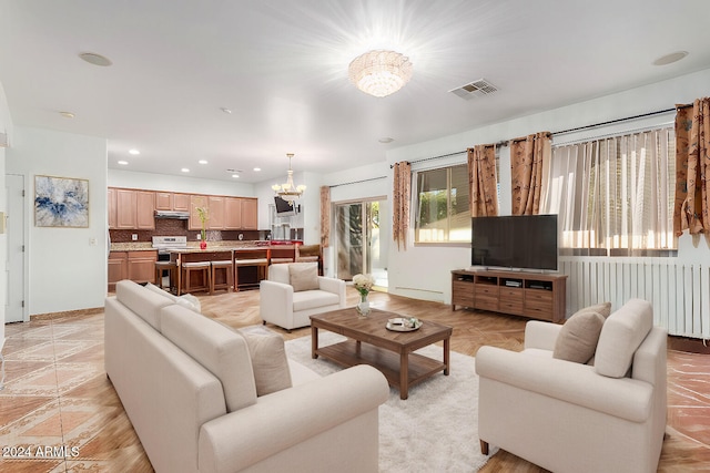 living room with an inviting chandelier