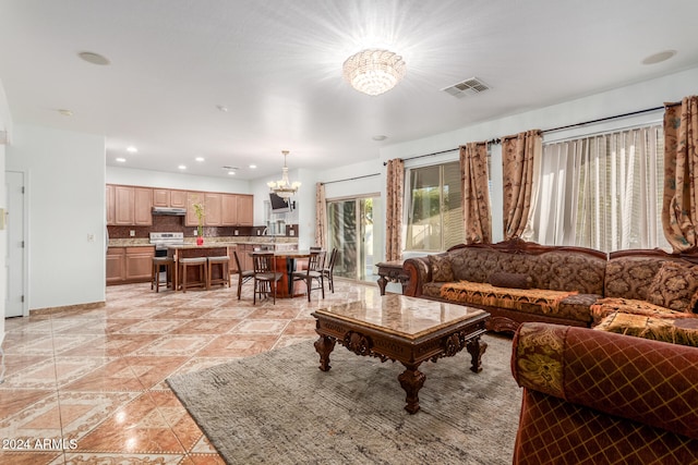 living room featuring a notable chandelier