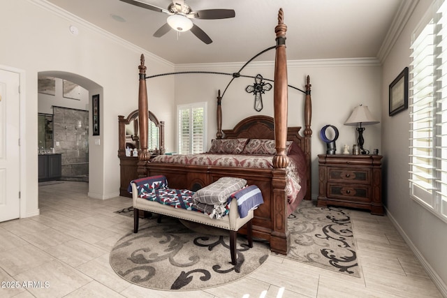 bedroom featuring ceiling fan, ornamental molding, and ensuite bathroom