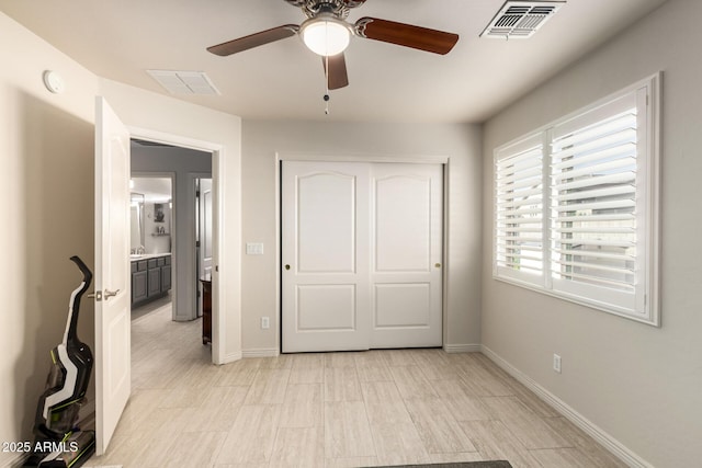 unfurnished bedroom featuring a closet and ceiling fan