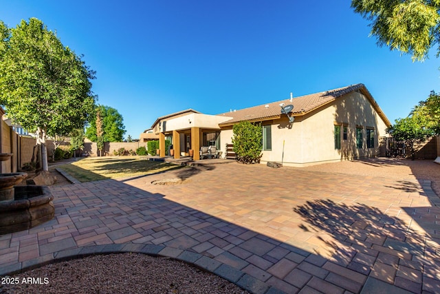 back of house featuring a patio