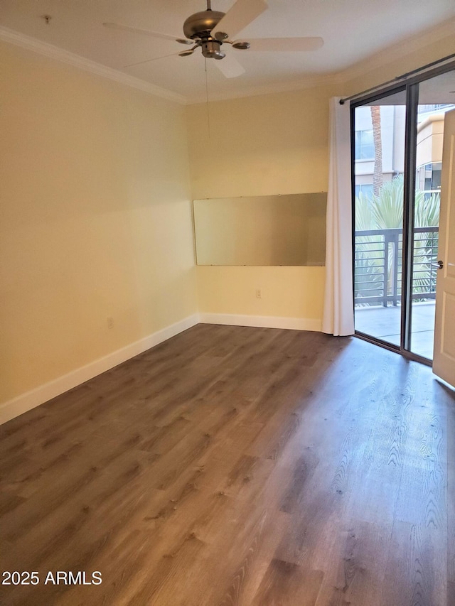 empty room featuring ceiling fan, dark hardwood / wood-style flooring, and ornamental molding