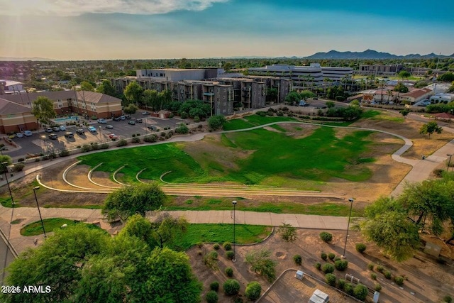 aerial view at dusk featuring a mountain view