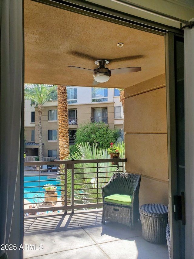 balcony featuring ceiling fan