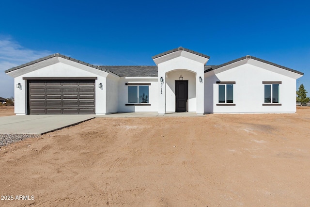 view of front of home with a garage