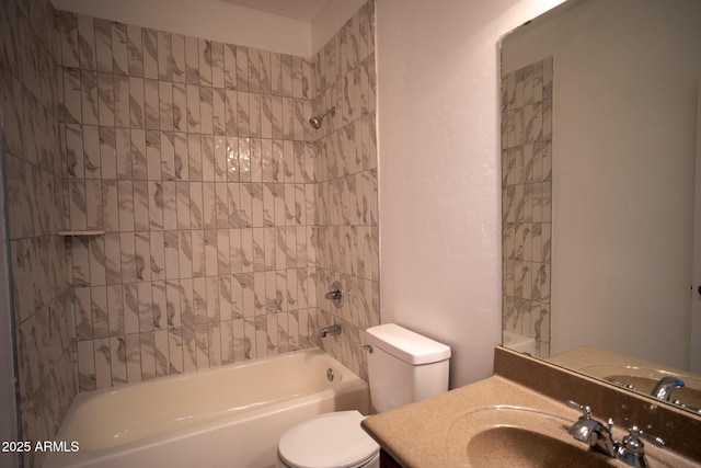 bathroom with toilet, shower / washtub combination, and vanity