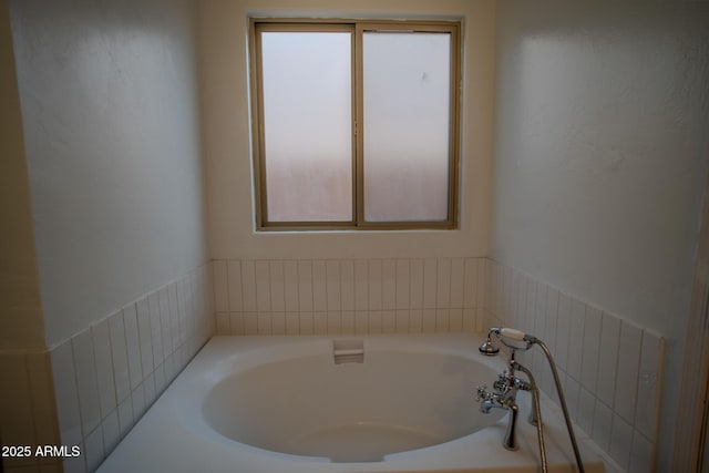 bathroom featuring a bath