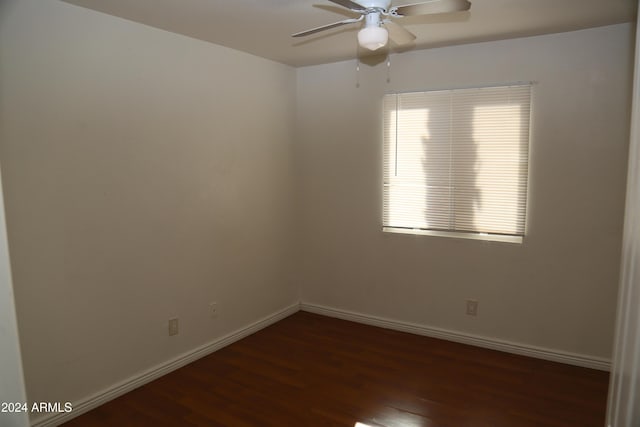 empty room featuring dark hardwood / wood-style floors and ceiling fan