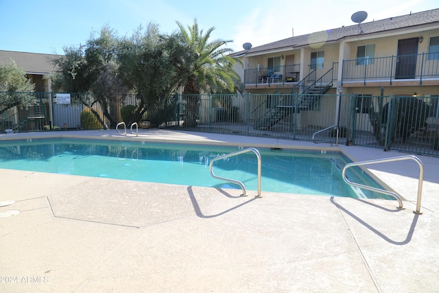 view of swimming pool featuring a patio area