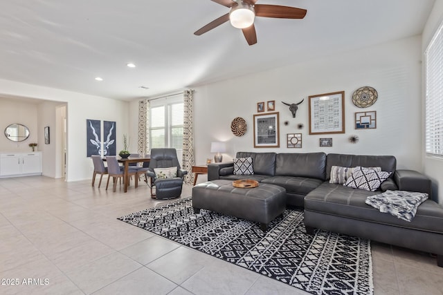 tiled living area featuring recessed lighting and a ceiling fan