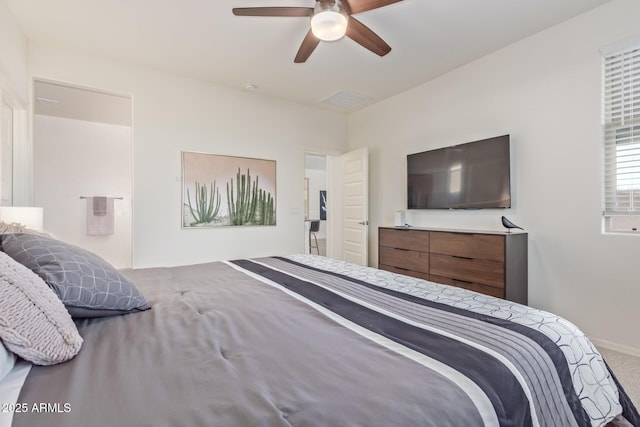 carpeted bedroom with a ceiling fan, visible vents, and baseboards